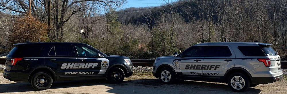 Stone County Sheriff vehicles parked and facing each other.
